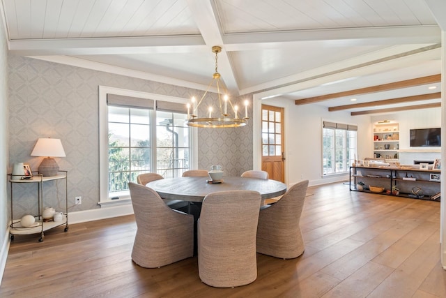 6115 Hillsboro Pike, Nashville, TN 37215 - dining area featuring wallpapered walls, beamed ceiling, baseboards, a chandelier, and hardwood / wood-style floors