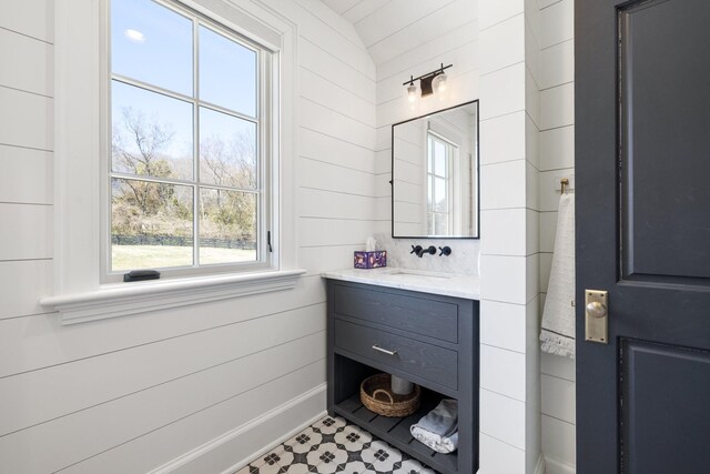 6115 Hillsboro Pike, Nashville, TN 37215 - bathroom featuring plenty of natural light, vanity, and wooden walls