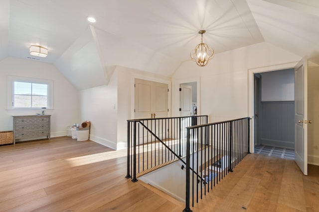 6115 Hillsboro Pike, Nashville, TN 37215 - additional living space featuring vaulted ceiling, light wood-style flooring, baseboards, and a chandelier