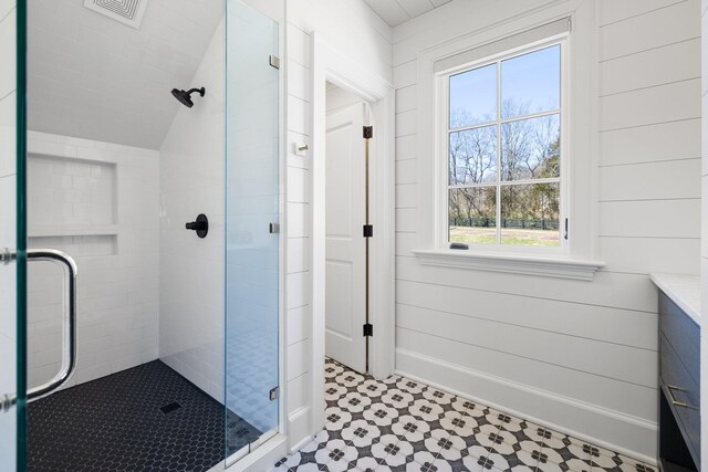6115 Hillsboro Pike, Nashville, TN 37215 - bathroom featuring a shower stall, vanity, and vaulted ceiling