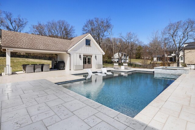 6115 Hillsboro Pike, Nashville, TN 37215 - view of swimming pool with an in-ground hot tub, an exterior structure, a patio, and an outdoor structure