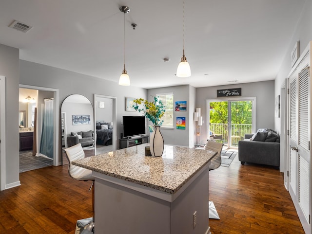 1118 Litton Ave Unit 218, Nashville, TN 37216 - kitchen with open floor plan, dark wood finished floors, a kitchen island, and arched walkways