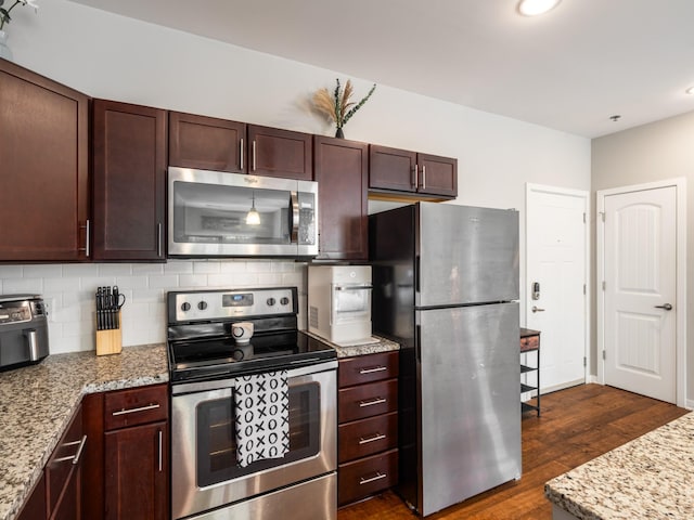 1118 Litton Ave Unit 218, Nashville, TN 37216 - kitchen featuring appliances with stainless steel finishes, tasteful backsplash, dark wood-style flooring, light stone countertops, and recessed lighting