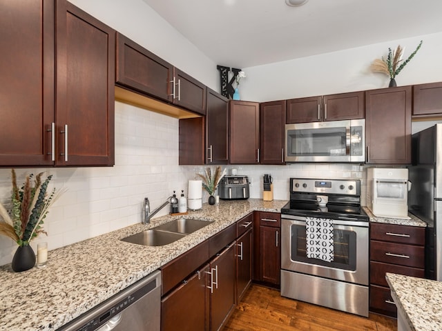 1118 Litton Ave Unit 218, Nashville, TN 37216 - kitchen with stainless steel appliances, a sink, light stone counters, and backsplash