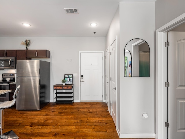 1118 Litton Ave Unit 218, Nashville, TN 37216 - kitchen with stainless steel appliances, dark wood finished floors, dark brown cabinetry, and recessed lighting