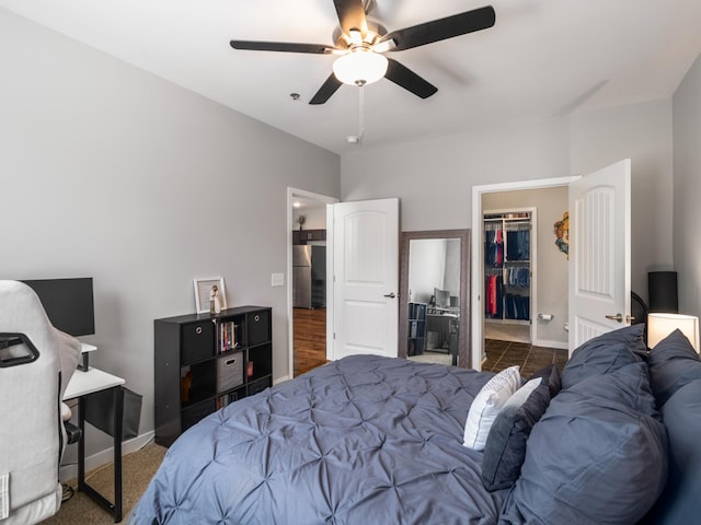 1118 Litton Ave Unit 218, Nashville, TN 37216 - bedroom with freestanding refrigerator, a walk in closet, baseboards, and a closet