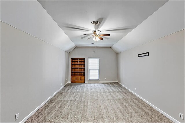1410 Wall St, Murfreesboro, TN 37130 - additional living space featuring ceiling fan, baseboards, vaulted ceiling, light carpet, and built in shelves
