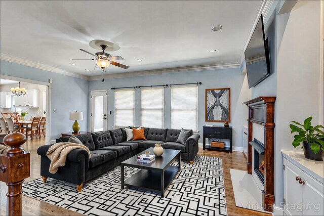1410 Wall St, Murfreesboro, TN 37130 - living room with light wood finished floors, a ceiling fan, a fireplace with flush hearth, baseboards, and recessed lighting