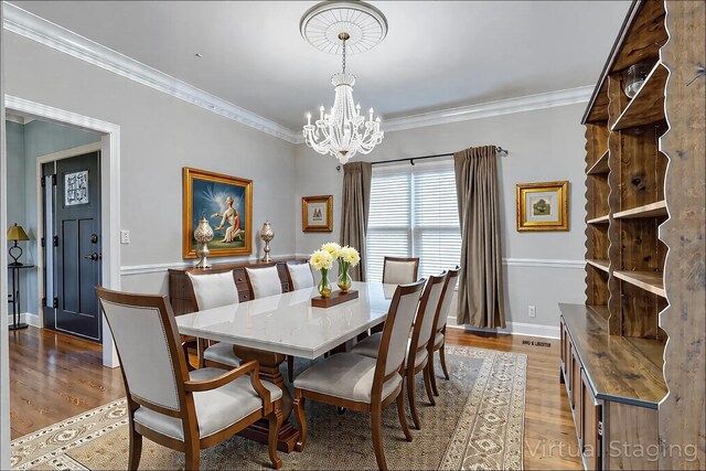 1410 Wall St, Murfreesboro, TN 37130 - dining room featuring a chandelier, light wood-style floors, ornamental molding, and baseboards