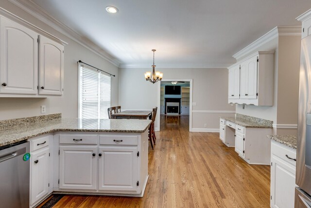 1410 Wall St, Murfreesboro, TN 37130 - kitchen featuring dishwasher, a chandelier, a peninsula, light wood finished floors, and white cabinets