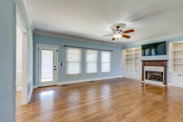 1410 Wall St, Murfreesboro, TN 37130 - unfurnished living room with ceiling fan, ornamental molding, a fireplace, wood finished floors, and baseboards