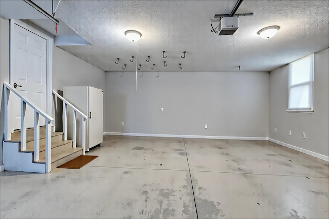 1410 Wall St, Murfreesboro, TN 37130 - garage featuring baseboards and a garage door opener