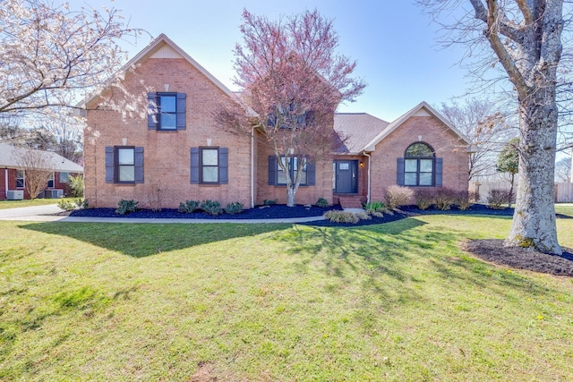 1410 Wall St, Murfreesboro, TN 37130 - view of front facade featuring brick siding and a front lawn