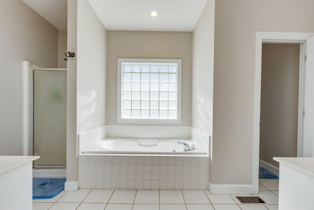 1410 Wall St, Murfreesboro, TN 37130 - full bath featuring a stall shower, a bath, vanity, and tile patterned floors