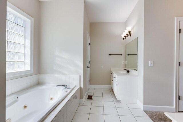 1410 Wall St, Murfreesboro, TN 37130 - bathroom featuring vanity, a jetted tub, tile patterned flooring, and baseboards