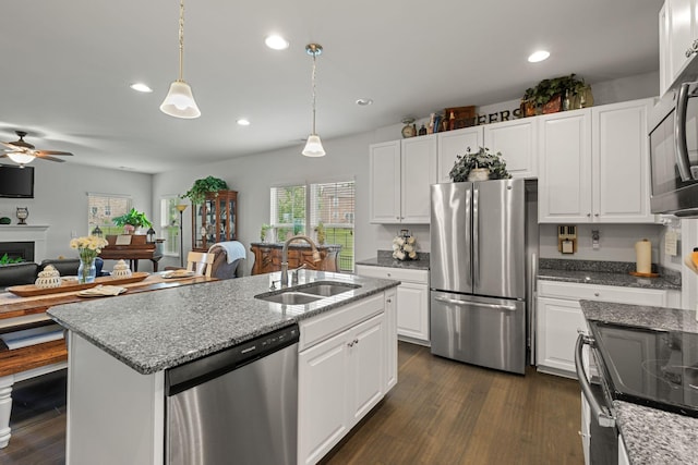 108 Rotondi Ct, Gallatin, TN 37066 - kitchen with stainless steel appliances, a sink, a ceiling fan, white cabinets, and pendant lighting