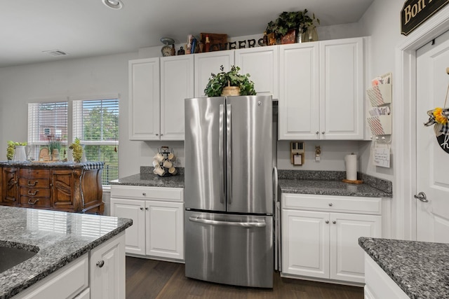 108 Rotondi Ct, Gallatin, TN 37066 - kitchen with freestanding refrigerator, white cabinetry, and dark stone counters