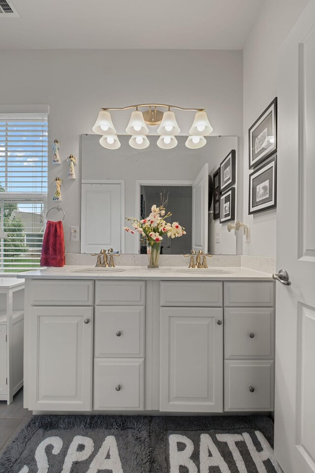 108 Rotondi Ct, Gallatin, TN 37066 - bathroom featuring double vanity, tile patterned floors, and a chandelier