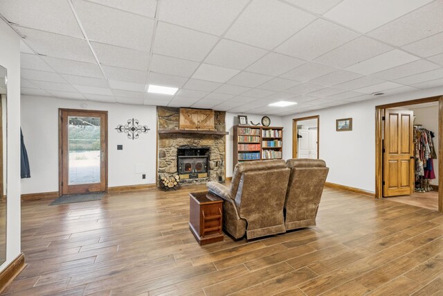 2797 Lewis Rd, Santa Fe, TN 38482 - living room featuring wood finished floors, a drop ceiling, baseboards, and a fireplace