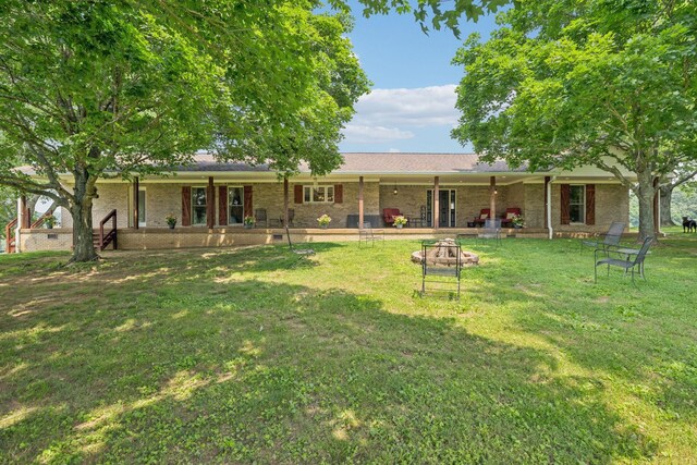 2797 Lewis Rd, Santa Fe, TN 38482 - rear view of property featuring a lawn and brick siding