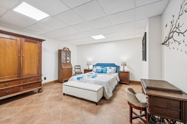 2797 Lewis Rd, Santa Fe, TN 38482 - bedroom featuring a drop ceiling, light tile patterned floors, and baseboards