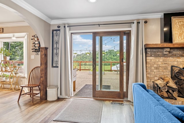 2797 Lewis Rd, Santa Fe, TN 38482 - doorway featuring arched walkways, wood finished floors, and ornamental molding