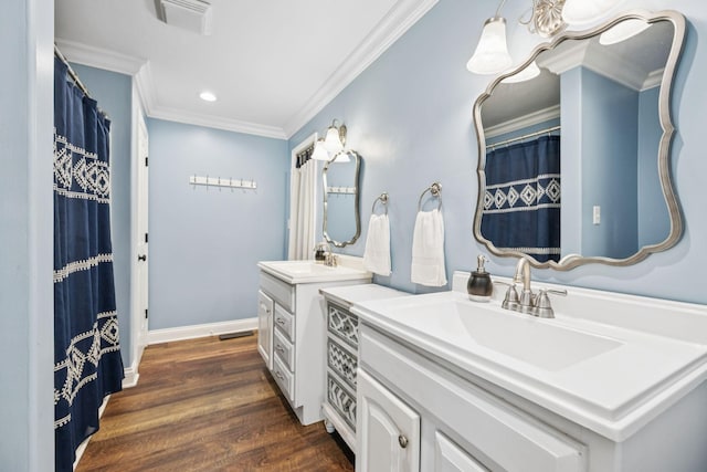 2797 Lewis Rd, Santa Fe, TN 38482 - full bath featuring two vanities, crown molding, recessed lighting, wood finished floors, and baseboards