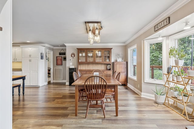 2797 Lewis Rd, Santa Fe, TN 38482 - dining room with baseboards, light wood-style flooring, crown molding, recessed lighting, and a chandelier