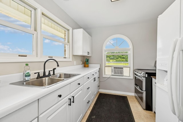 2797 Lewis Rd, Santa Fe, TN 38482 - kitchen with white fridge with ice dispenser, double oven range, a sink, white cabinets, and light tile patterned flooring
