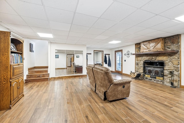 2797 Lewis Rd, Santa Fe, TN 38482 - living area featuring light wood-style flooring, a paneled ceiling, baseboards, and stairway