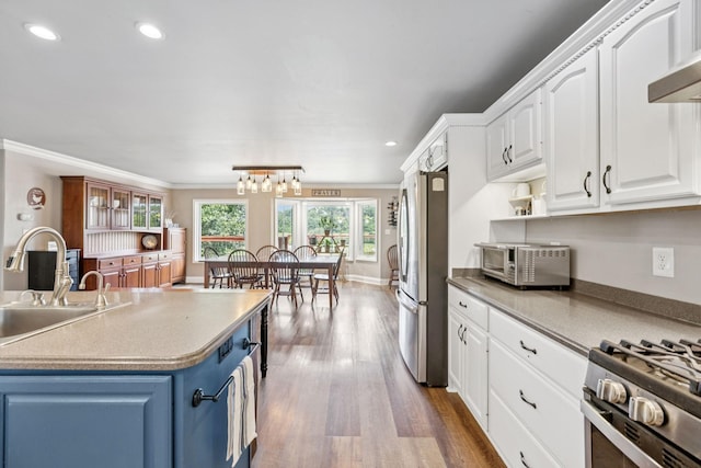 2797 Lewis Rd, Santa Fe, TN 38482 - kitchen with freestanding refrigerator, blue cabinets, a sink, white cabinetry, and recessed lighting