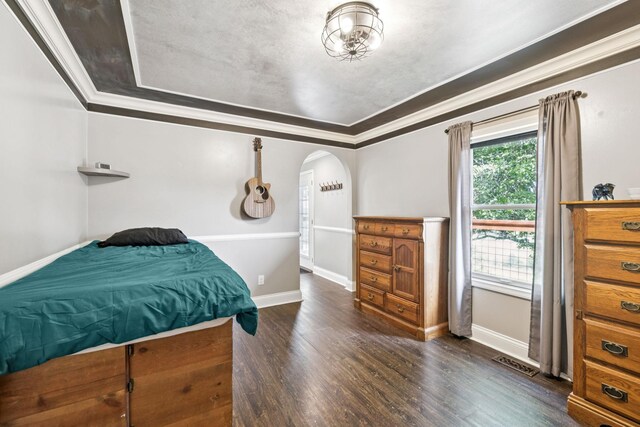 2797 Lewis Rd, Santa Fe, TN 38482 - bedroom featuring arched walkways, wood finished floors, ornamental molding, baseboards, and a raised ceiling