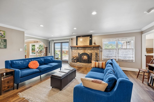 2797 Lewis Rd, Santa Fe, TN 38482 - living room featuring crown molding, plenty of natural light, wood finished floors, a brick fireplace, and recessed lighting