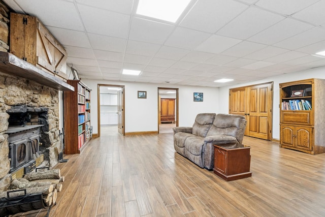 2797 Lewis Rd, Santa Fe, TN 38482 - living area featuring light wood finished floors, baseboards, and a paneled ceiling