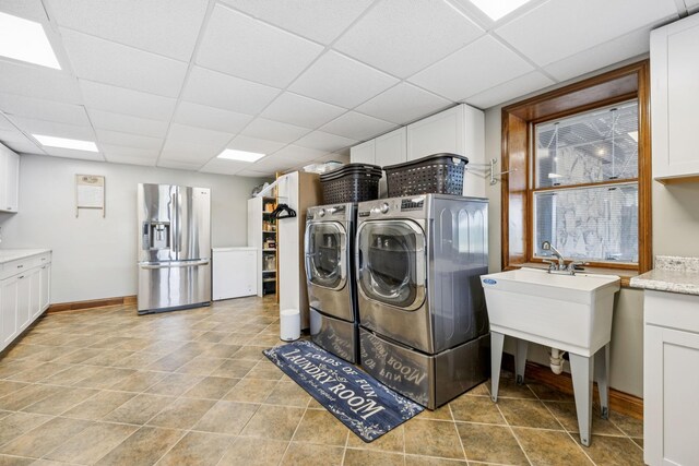 2797 Lewis Rd, Santa Fe, TN 38482 - laundry area with separate washer and dryer, cabinet space, and baseboards