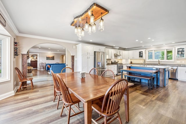 2797 Lewis Rd, Santa Fe, TN 38482 - dining room featuring arched walkways, light wood finished floors, ornamental molding, recessed lighting, and baseboards