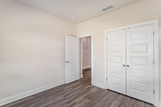 36 Audubon Ln, Murfreesboro, TN 37128 - unfurnished bedroom with dark wood-style flooring, baseboards, and a closet
