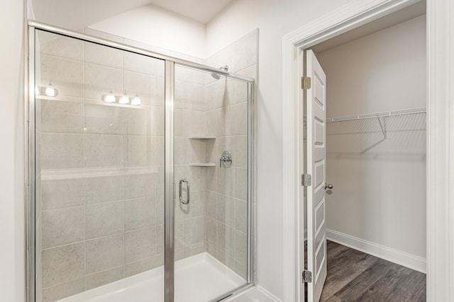 35 Audubon Ln, Murfreesboro, TN 37128 - bathroom with a stall shower, wood finished floors, a spacious closet, and baseboards