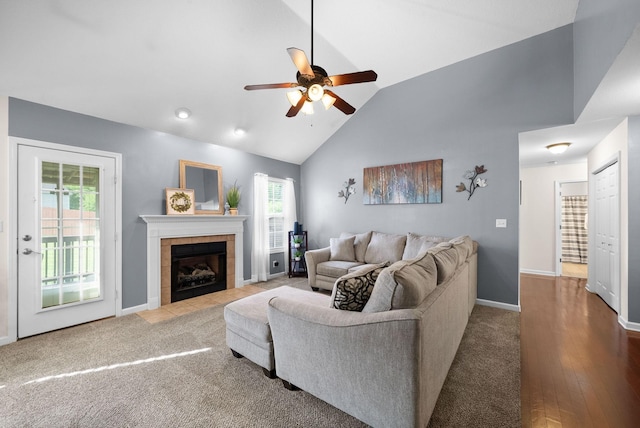 3129 Brook Hill Dr, Clarksville, TN 37042 - living room featuring a ceiling fan, plenty of natural light, a tiled fireplace, vaulted ceiling, and baseboards