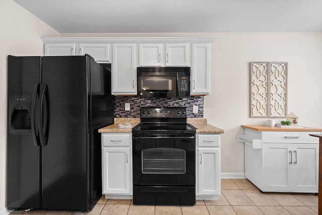3129 Brook Hill Dr, Clarksville, TN 37042 - kitchen featuring black appliances, light tile patterned floors, decorative backsplash, and white cabinets