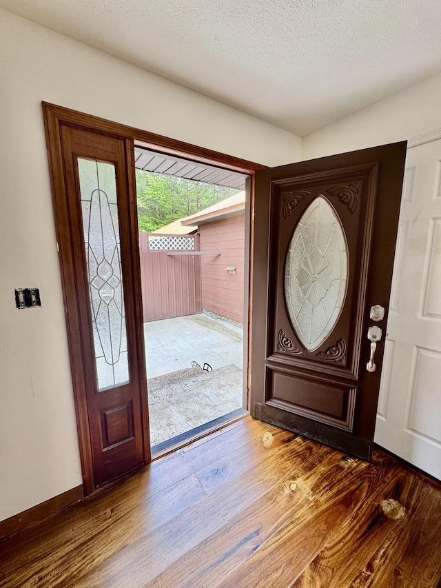 841 Mccord Hollow Rd, Hohenwald, TN 38462 - foyer with wood finished floors and a textured ceiling