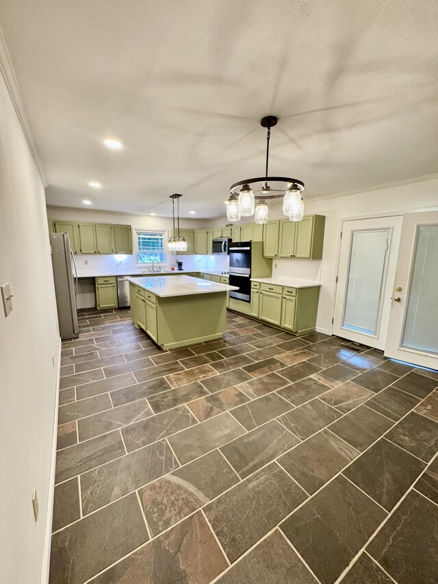 841 Mccord Hollow Rd, Hohenwald, TN 38462 - kitchen featuring green cabinetry, stainless steel appliances, a kitchen island, light countertops, and a sink