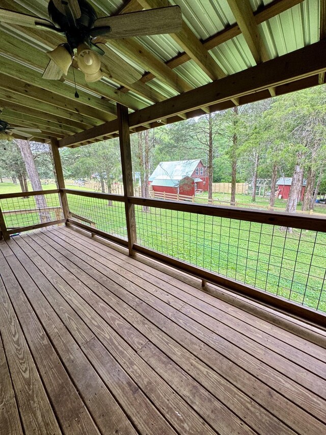 841 Mccord Hollow Rd, Hohenwald, TN 38462 - deck with ceiling fan, a lawn, and an outdoor structure