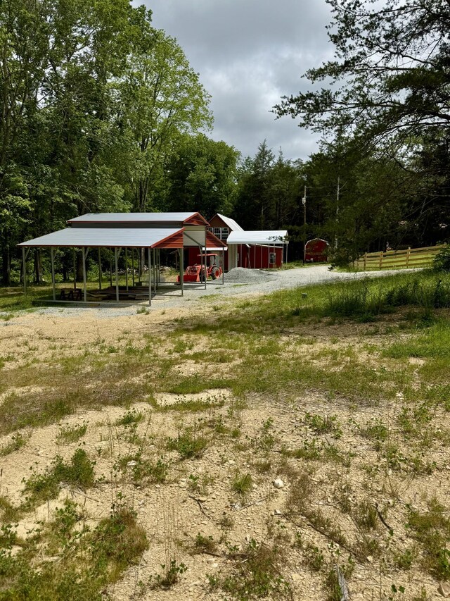 841 Mccord Hollow Rd, Hohenwald, TN 38462 - view of yard with a carport and a forest view