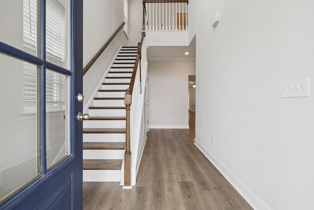 105 Artie Lee Ln, Nolensville, TN 37135 - staircase with a high ceiling, baseboards, wood finished floors, and crown molding
