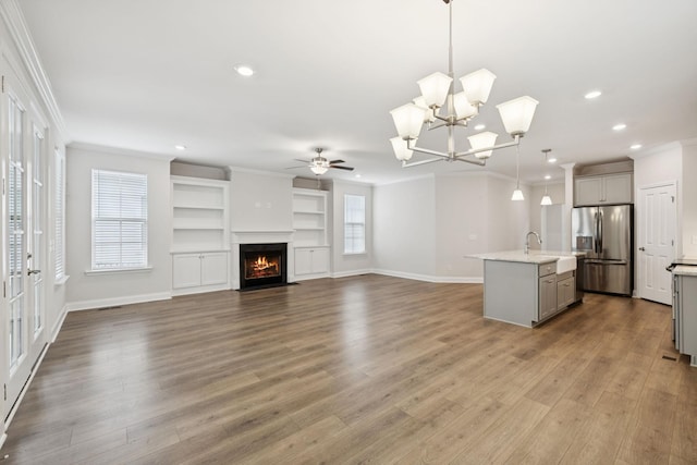 105 Artie Lee Ln, Nolensville, TN 37135 - unfurnished living room with ceiling fan, crown molding, recessed lighting, a fireplace with flush hearth, and baseboards