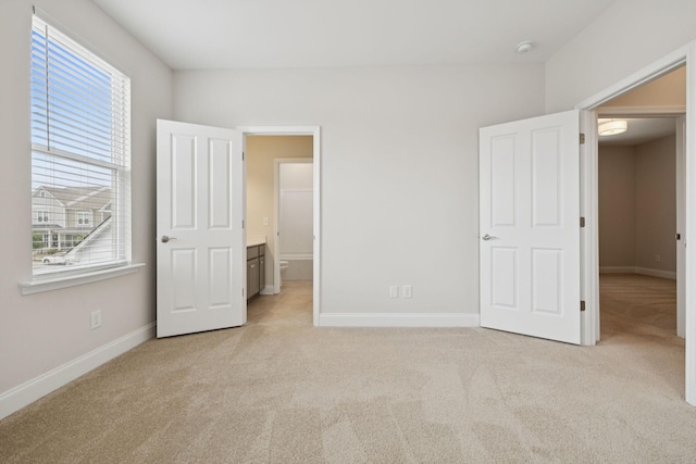 105 Artie Lee Ln, Nolensville, TN 37135 - unfurnished bedroom featuring light carpet, multiple windows, and baseboards
