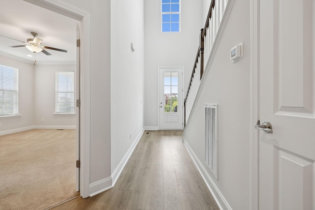 105 Artie Lee Ln, Nolensville, TN 37135 - entrance foyer with healthy amount of natural light, ceiling fan, baseboards, and crown molding