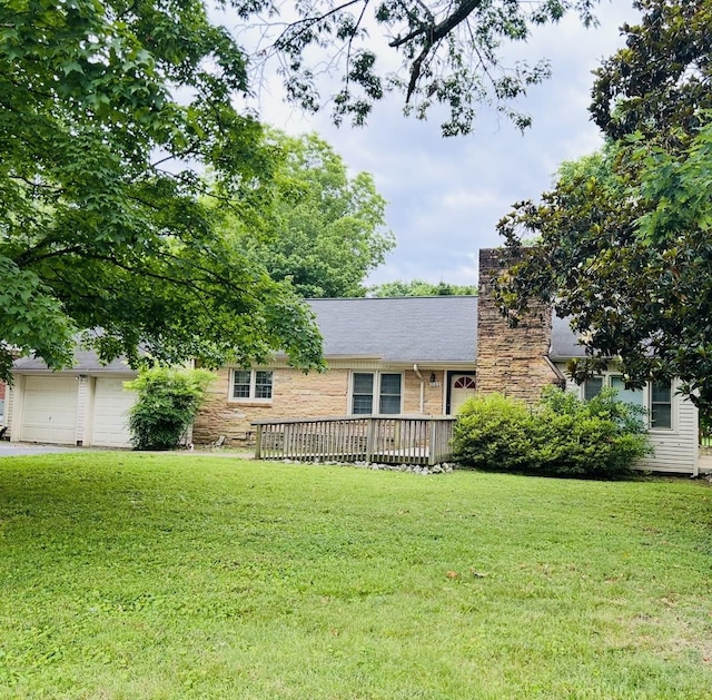 1102 Manor Rd, Columbia, TN 38401 - view of front facade featuring a chimney, a front yard, stone siding, and a deck