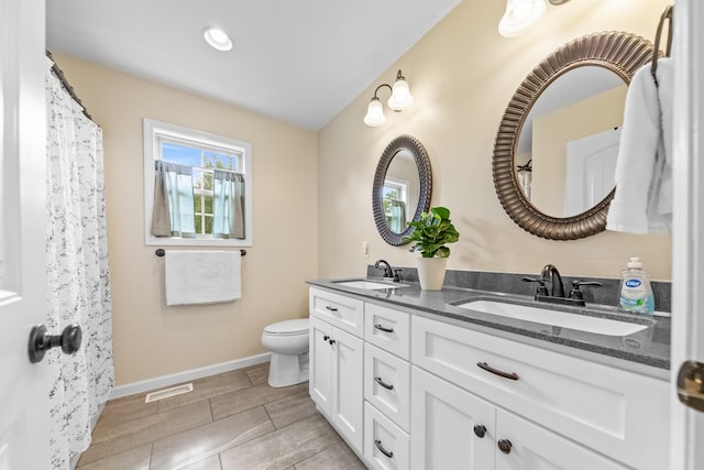2034 Glencoe Rd, Culleoka, TN 38451 - bathroom featuring double vanity and toilet